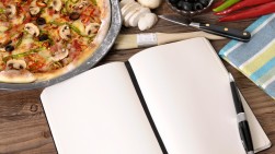 Freshly baked Pizza with cookbook Freshly baked Pizza with cookbook